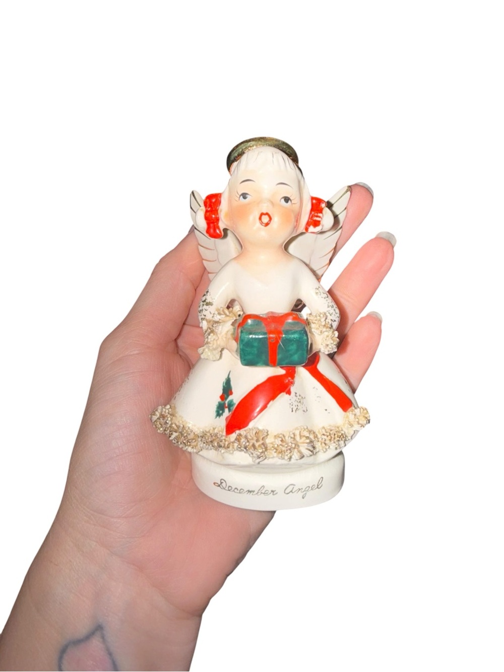 Vintage December angel figurine with present